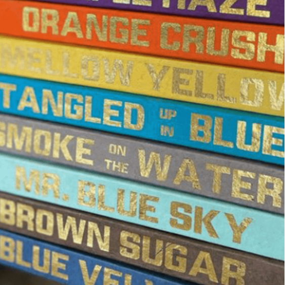 Blu Books - Gold Lettered Song Title on Brown Decor