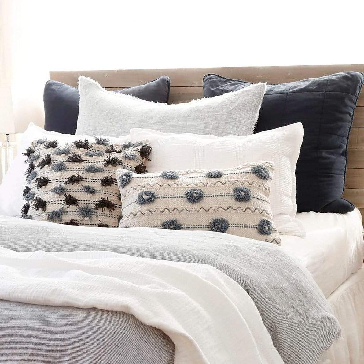 Navy pom pom pillow 2025